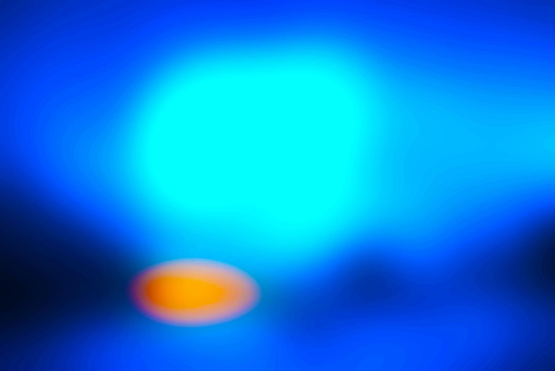 blurry image of blue colored light on dark background