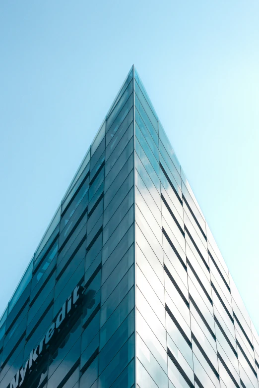 a building with a sky background with many windows