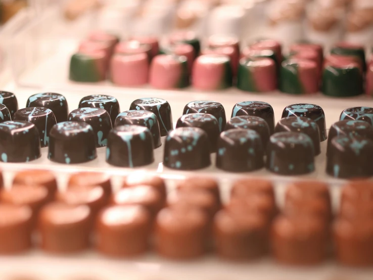 the chocolates are lined up and waiting to be put into the oven