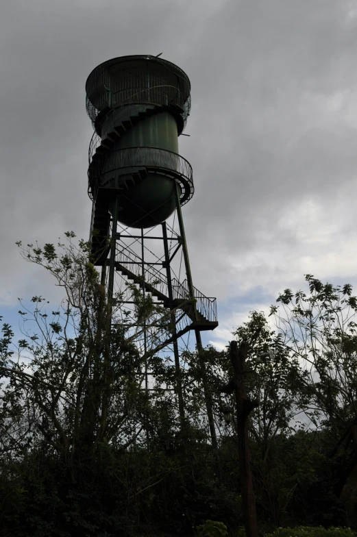 a tall tower with steps sitting on the side of it