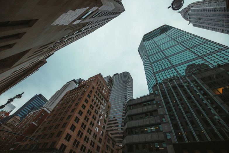 some buildings towering in the sky at dusk