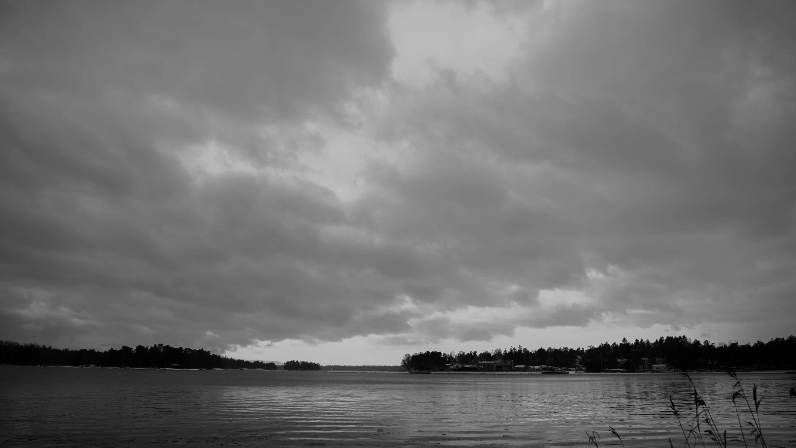 a black and white po of a sky filled with clouds