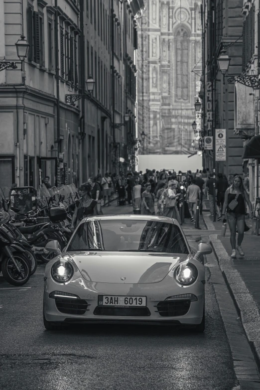 a black and white po of a car parked on a street