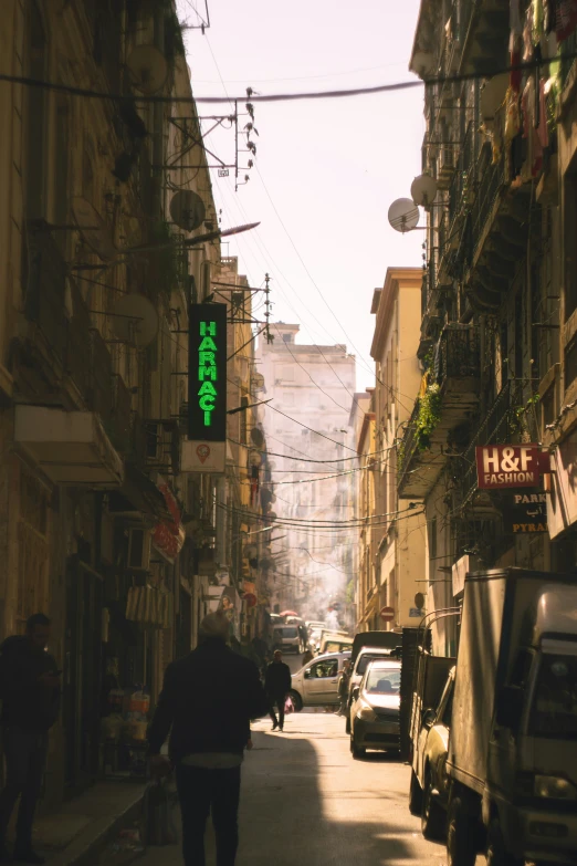 a green sign that is on the side of a building