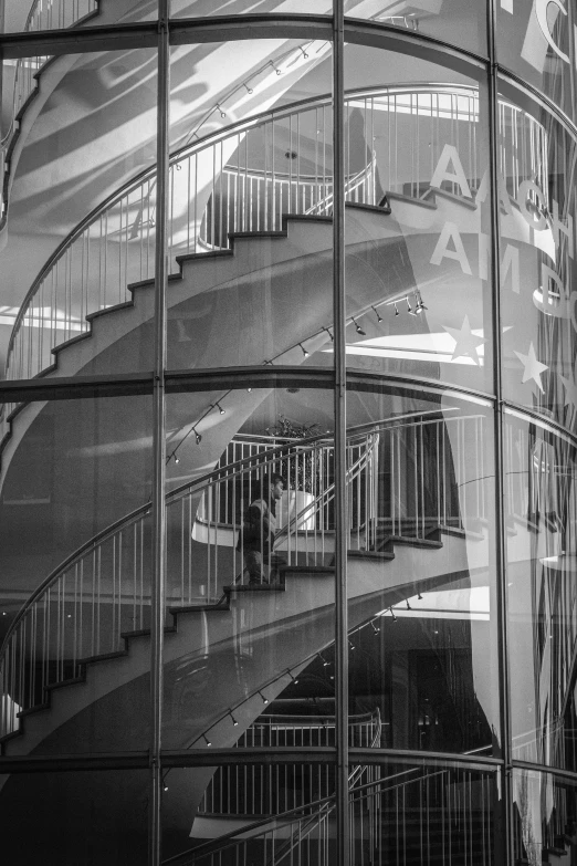 an abstract black and white po showing a spiral staircase