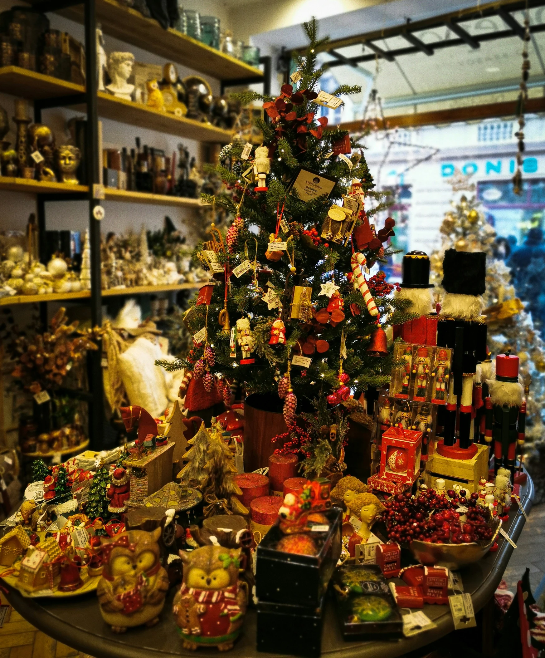 a table covered in lots of presents and a small christmas tree