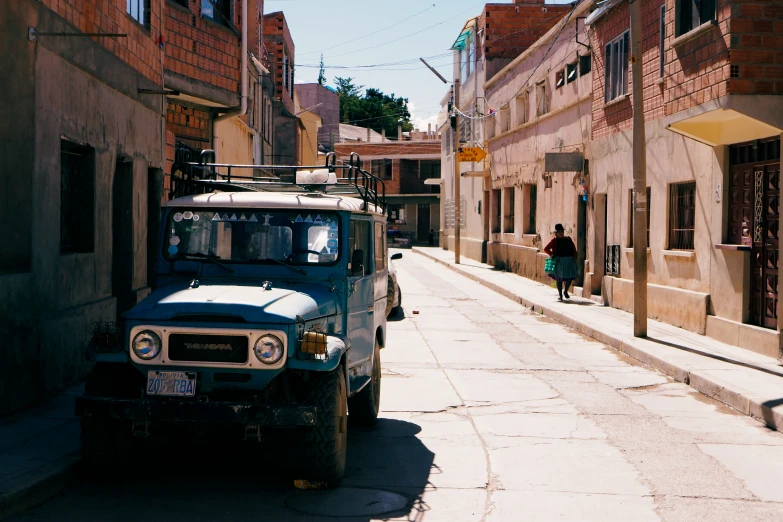 a man is walking near a small van