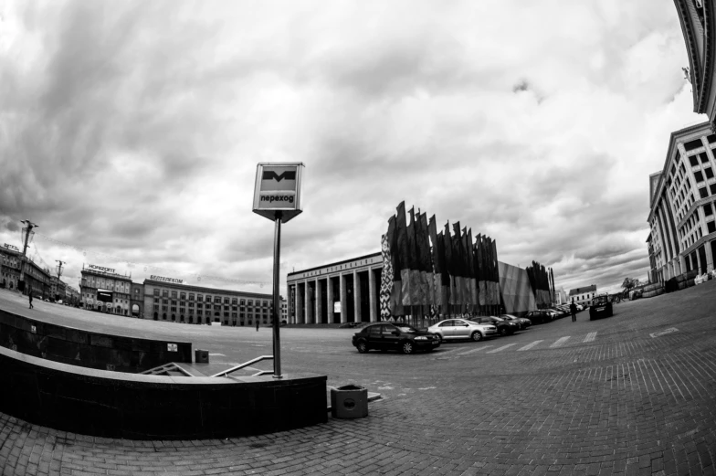 black and white pograph of a large building in an alley