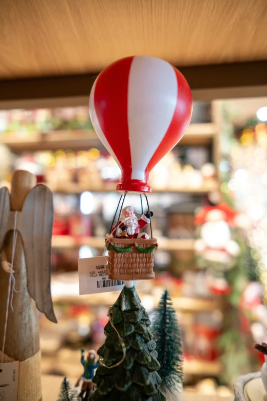  air balloon with an elf and santa clause sitting on it