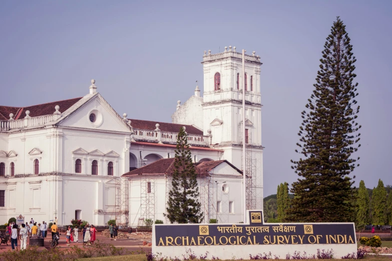 a large white church with lots of people