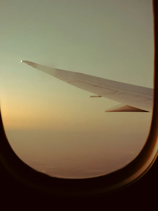 a view out the window of an airplane on a sunny day