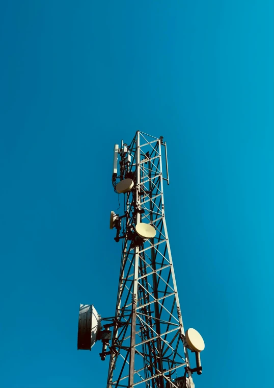 a very tall tower with several antennas on it