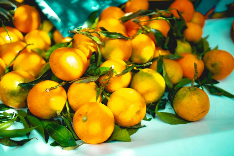 a bunch of oranges are piled on top of each other