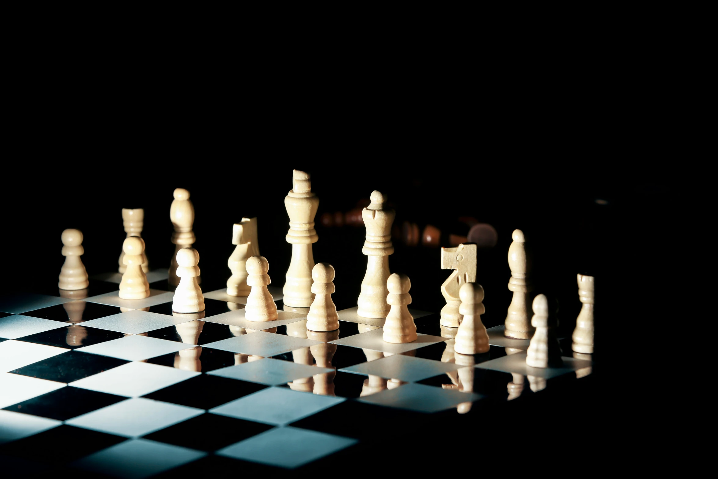 a chess set is shown with a black and white background