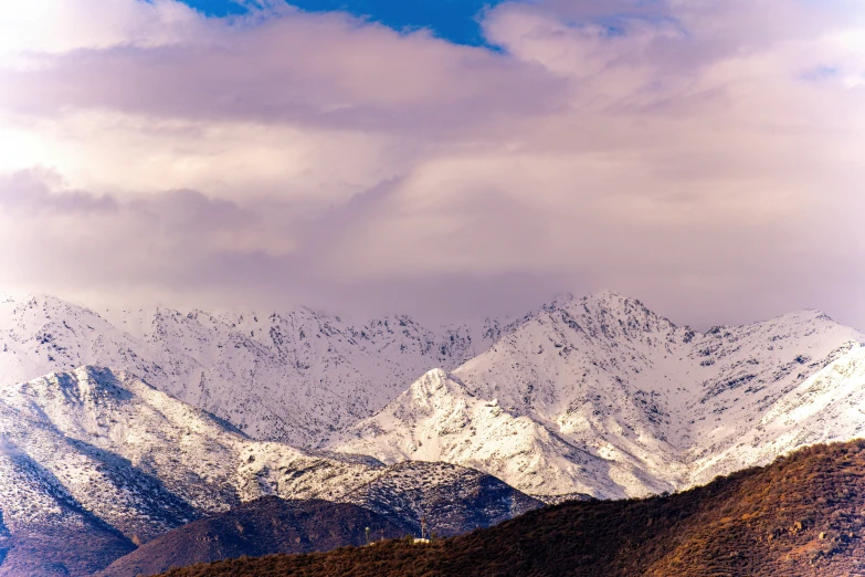 a large mountain range covered in snow