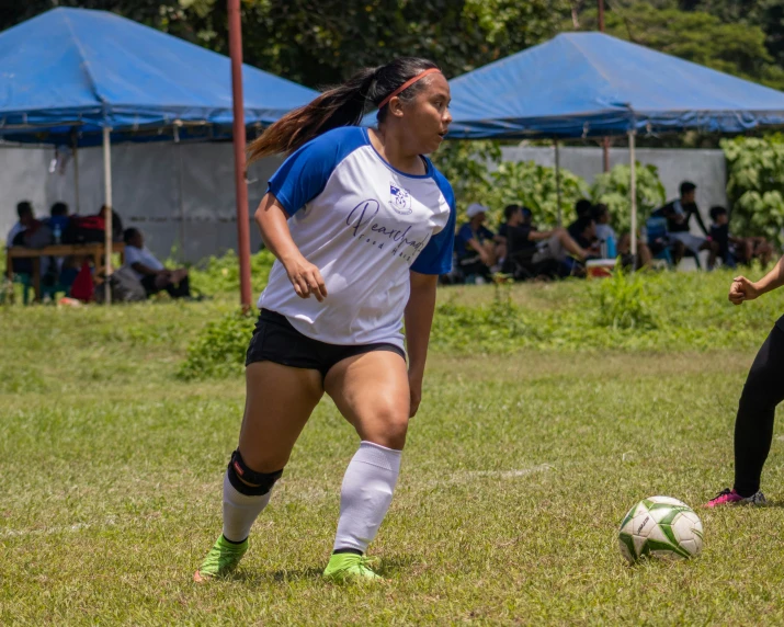 some girls are playing a game of soccer