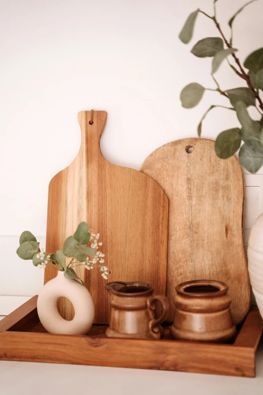 wood  board, creamer and two cups on a tray