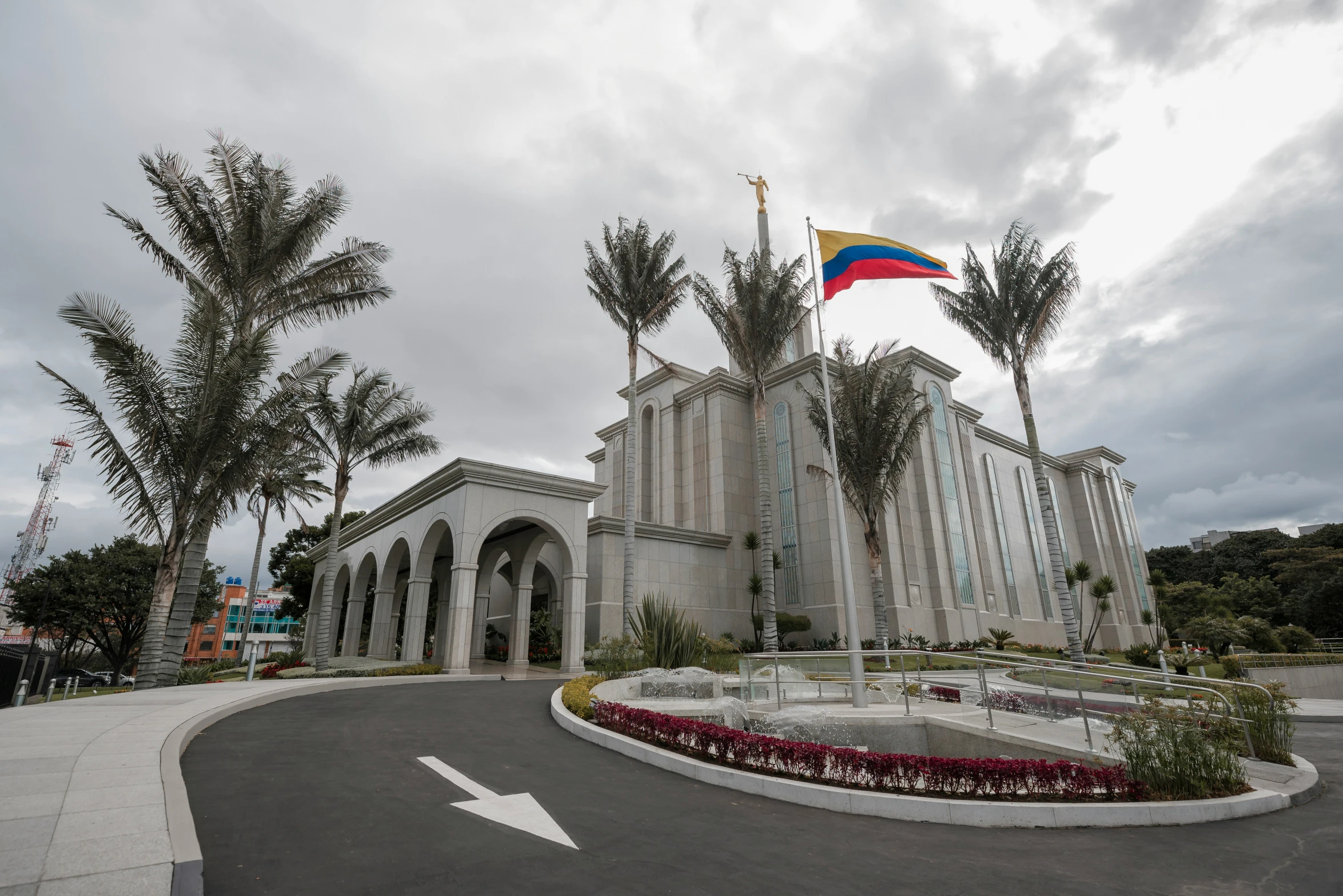 a building with an elaborate archway and flag on top