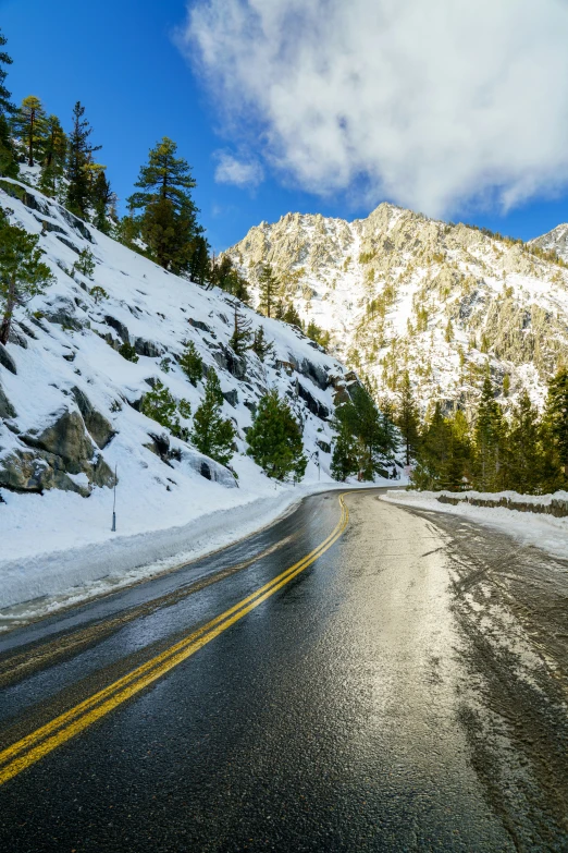 a road covered in snow on a hill