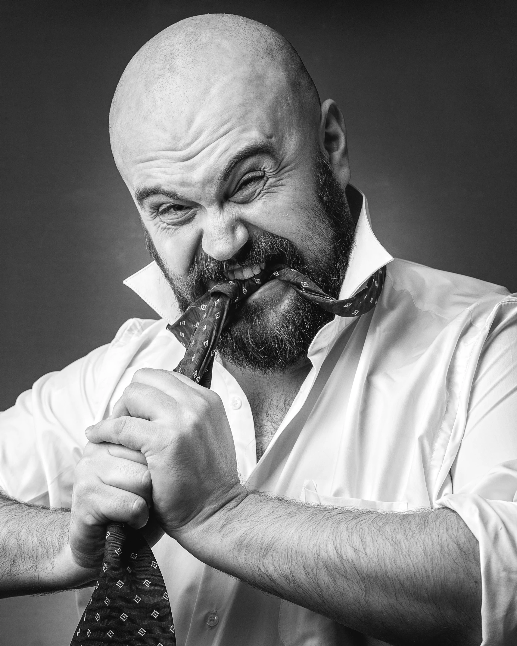 an image of a man holding a tie in his hands