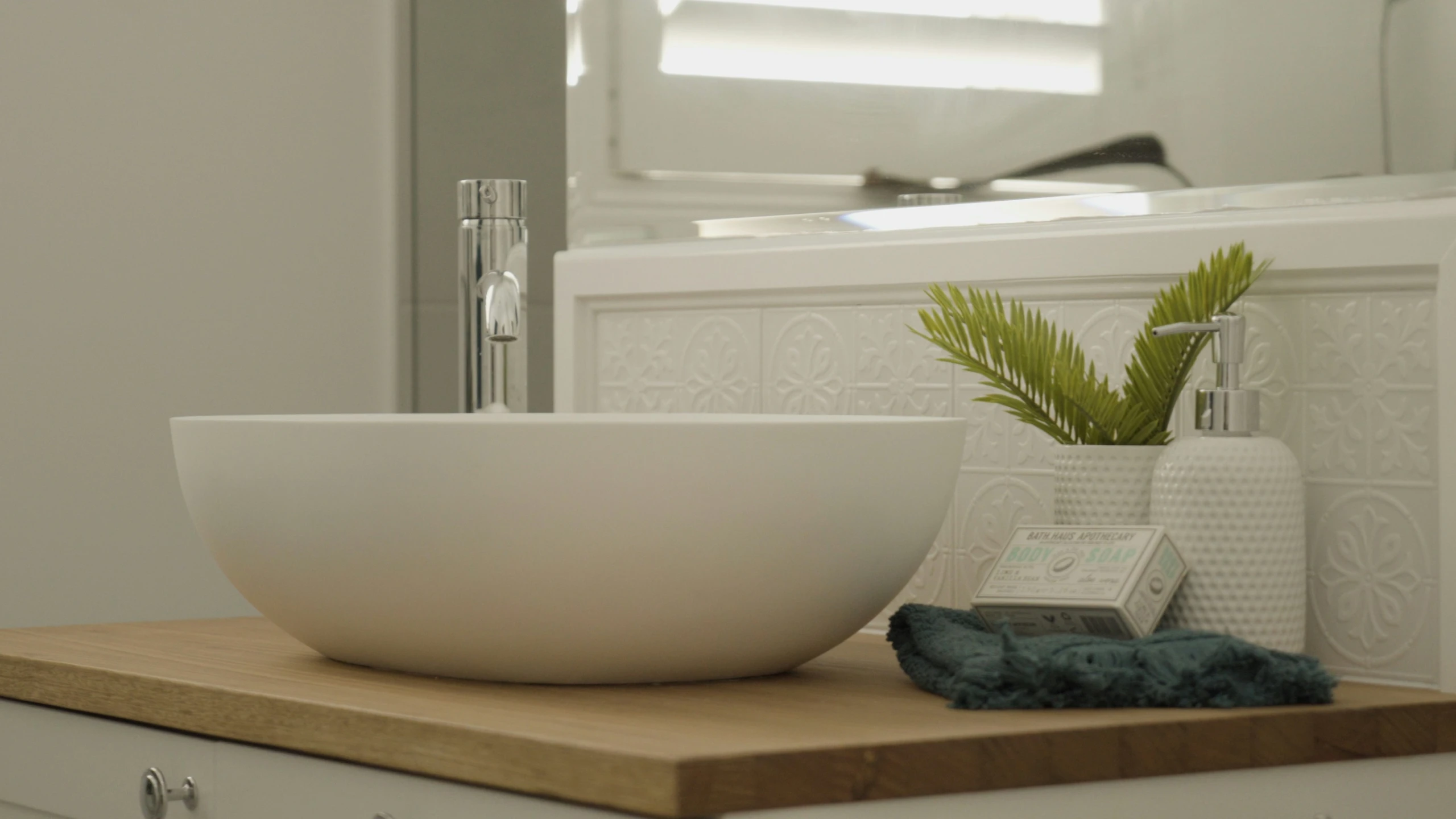 a bathroom countertop with a bowl on top