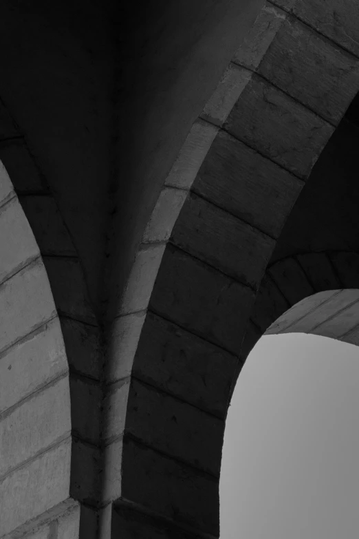 the underside view of two arches and one light