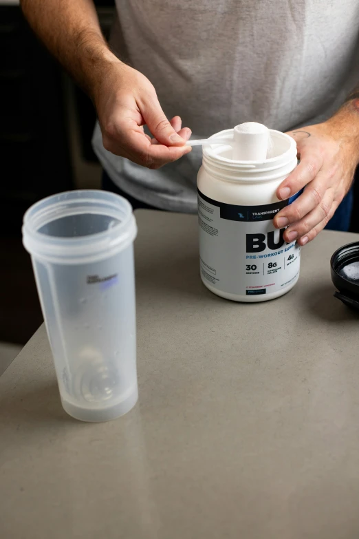 a person is putting sugar in the top container