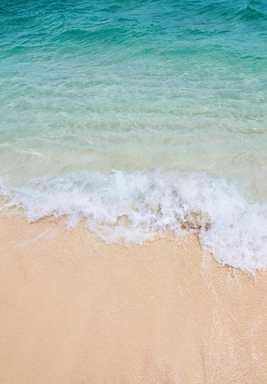 the sand and the sea at the beach are white