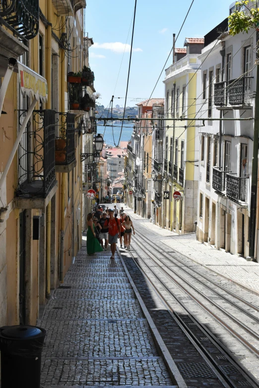 a narrow road that leads to the ocean