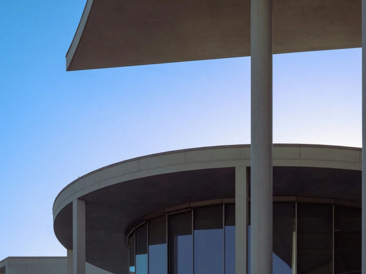 there is a bird flying over the top of a building