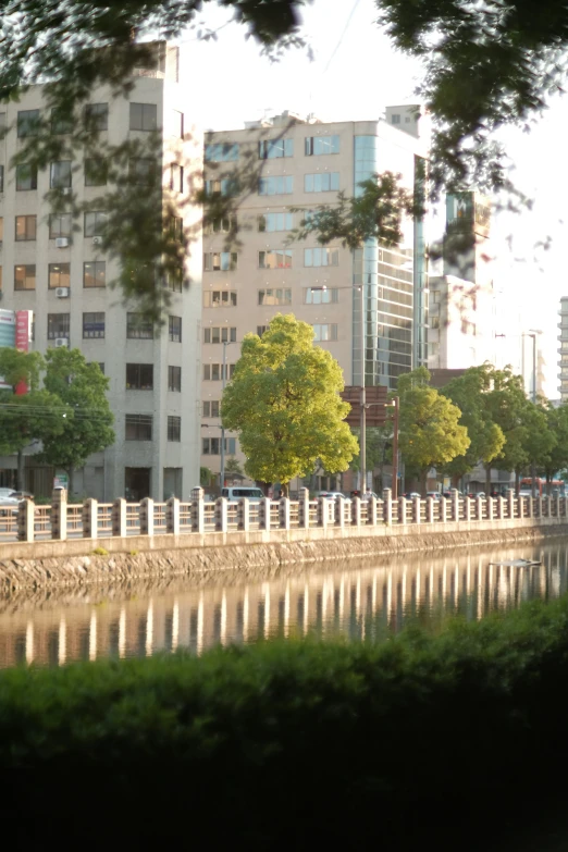 a large body of water next to tall buildings