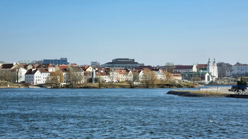 a view of many buildings on a river