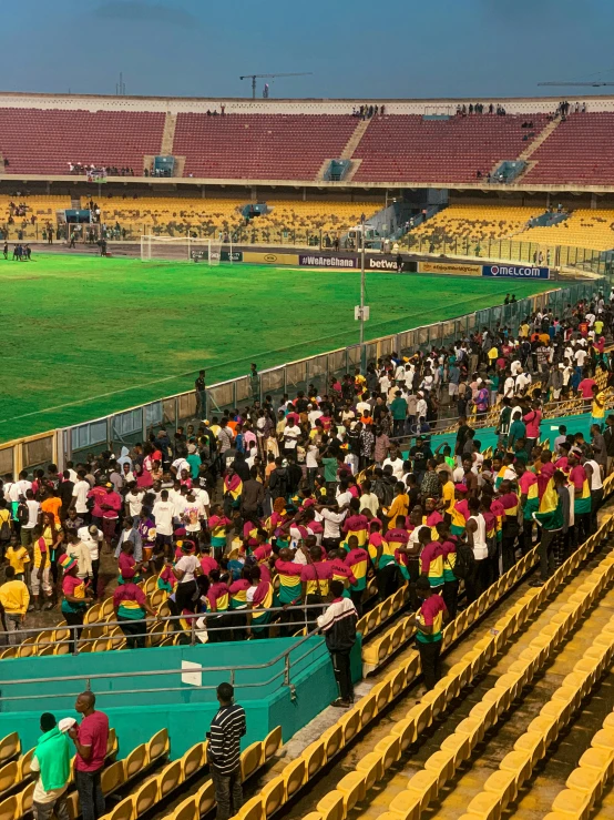 many people standing near one another with umbrellas