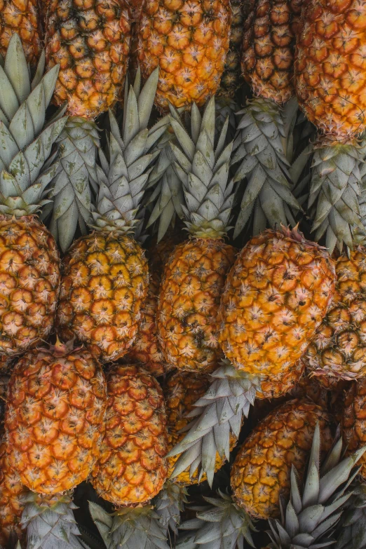 a fruit stand with lots of pineapple