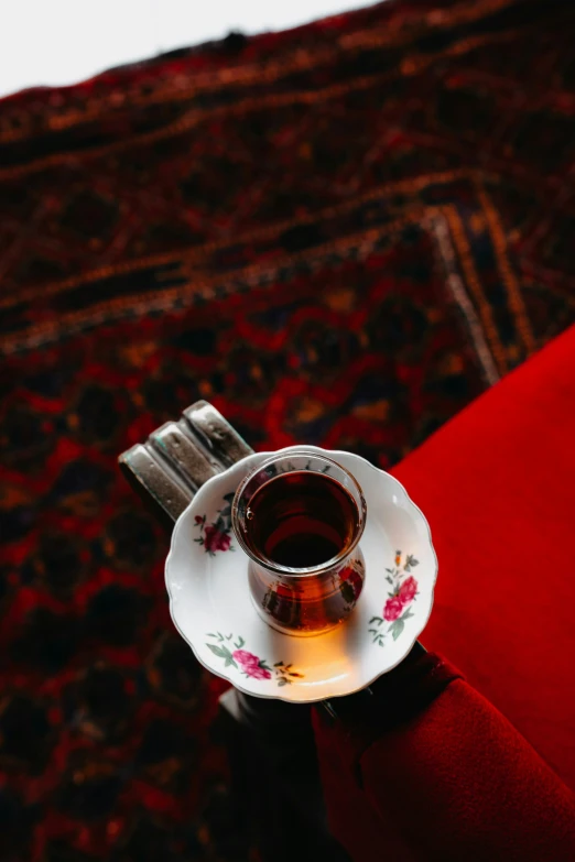 a tea cup on a saucer on a plate