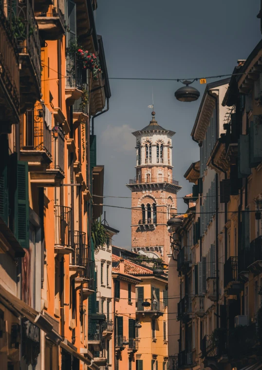 a building with an ancient bell tower sitting on the side of it