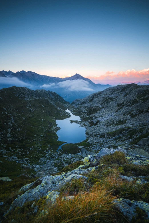 two mountains near each other with water in the distance