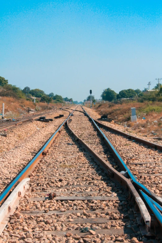 a rail road track is empty, no people are in it