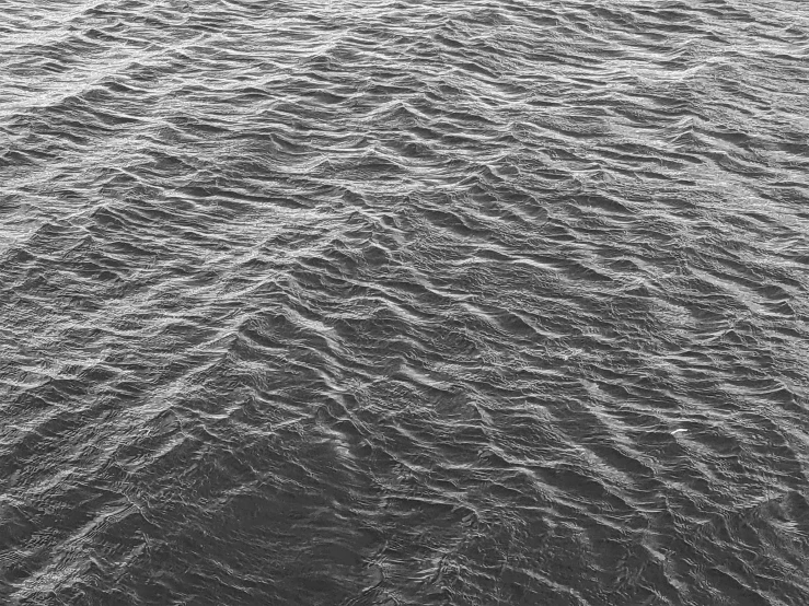 a person surfing on the water in a body of water