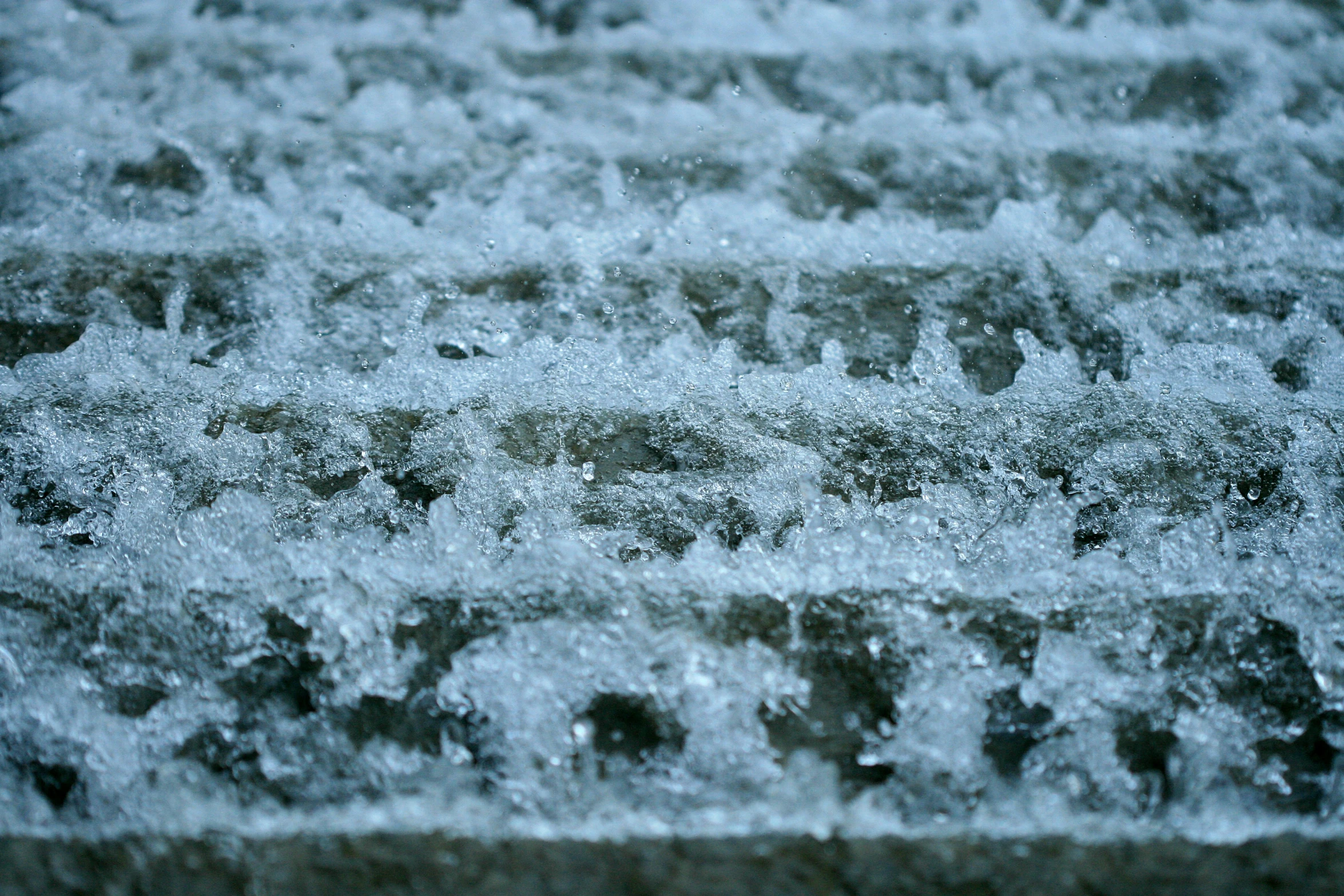 a view of the back side of a vehicle with a lot of snow on it