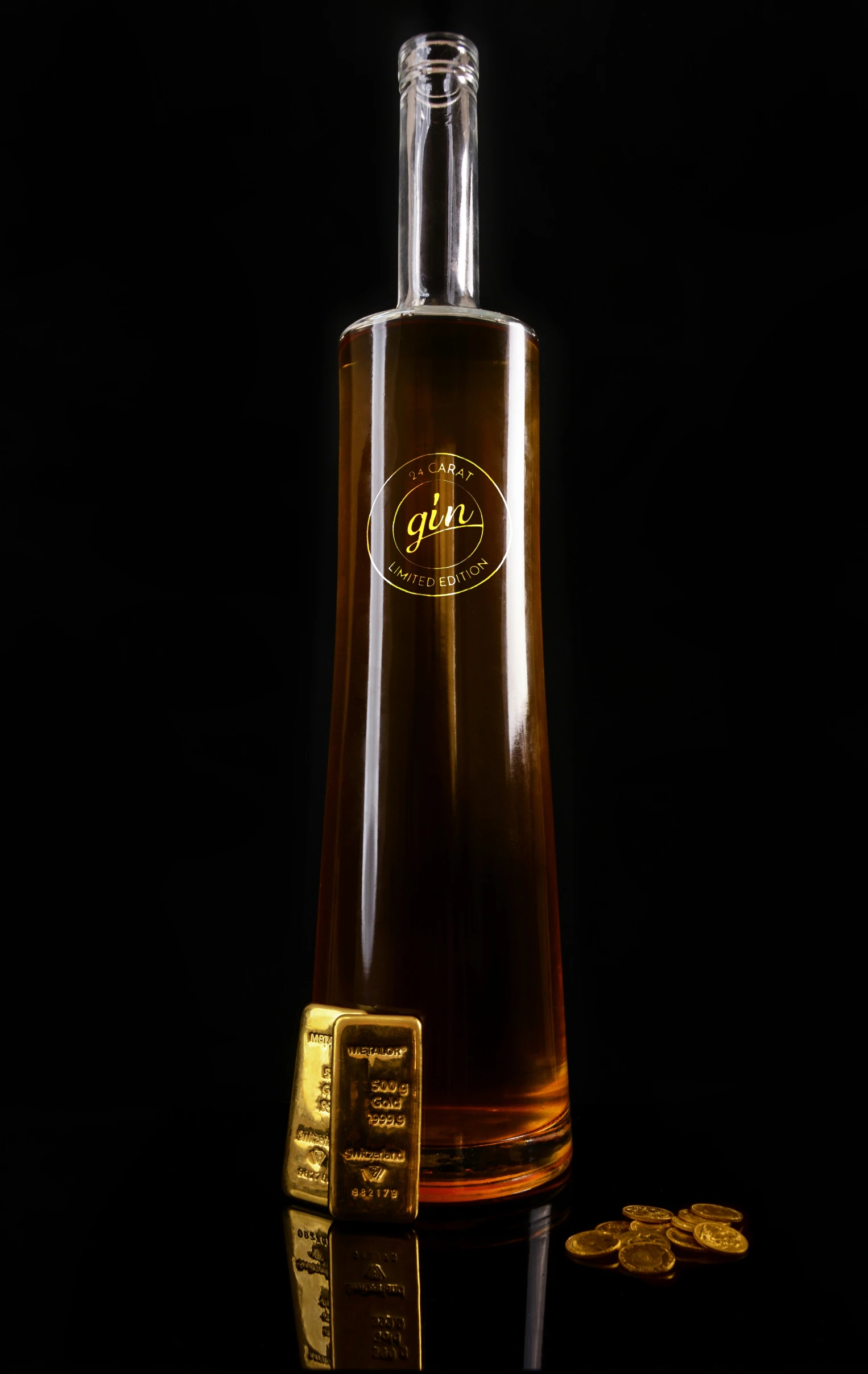 a bottle of liquid and a gold bar on a table