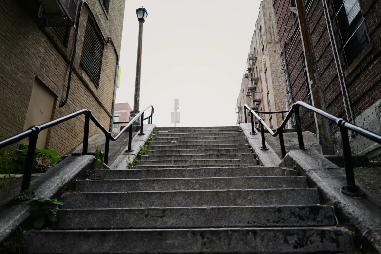 a staircase that goes down to a tall building