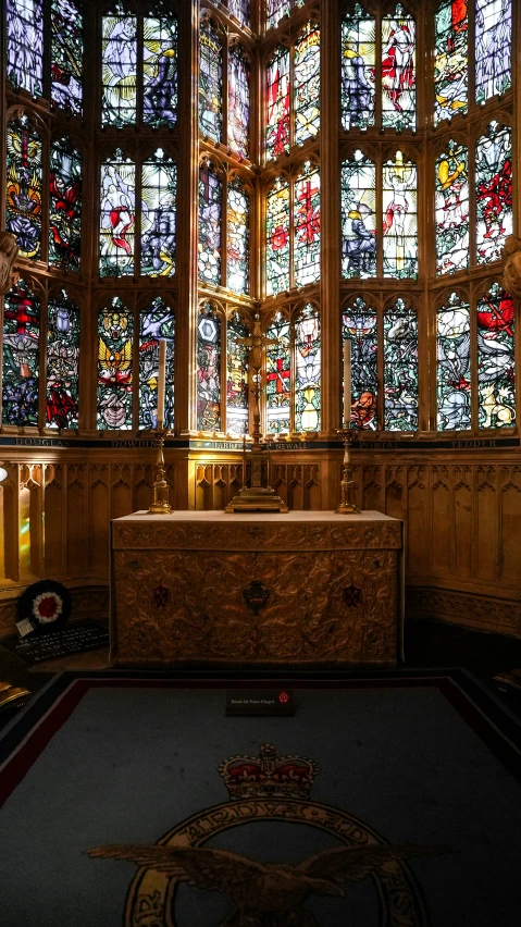 an elaborate stained glass window with gold and crystal decoration