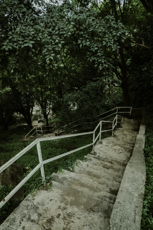 a cement steps next to a white fence