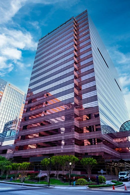 an office building in a city with skyscrs in the background