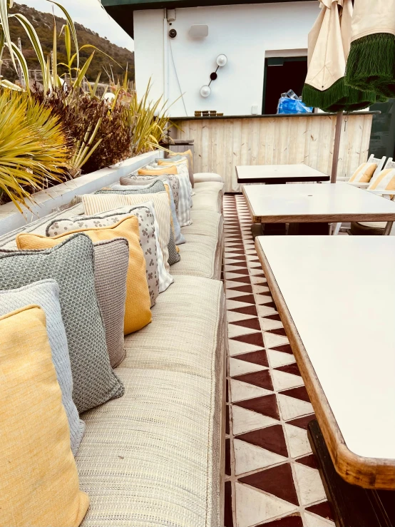 outdoor patio furniture with brown and white patterned cushions