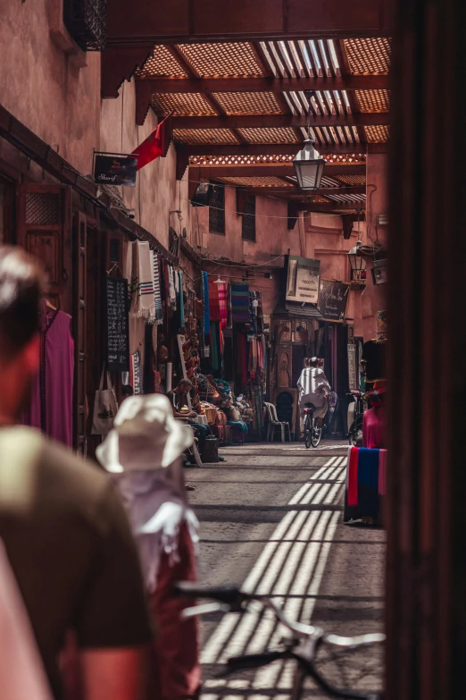 the man walking through the alley of a small village