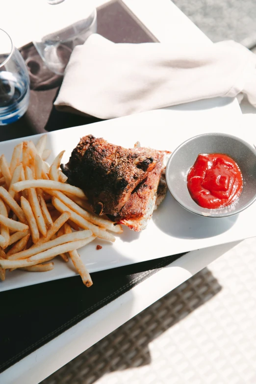 a table with a plate of food and a drink on it