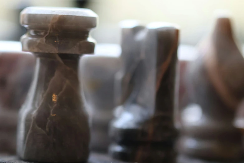 marble chess pieces in closeup all of them are lined up