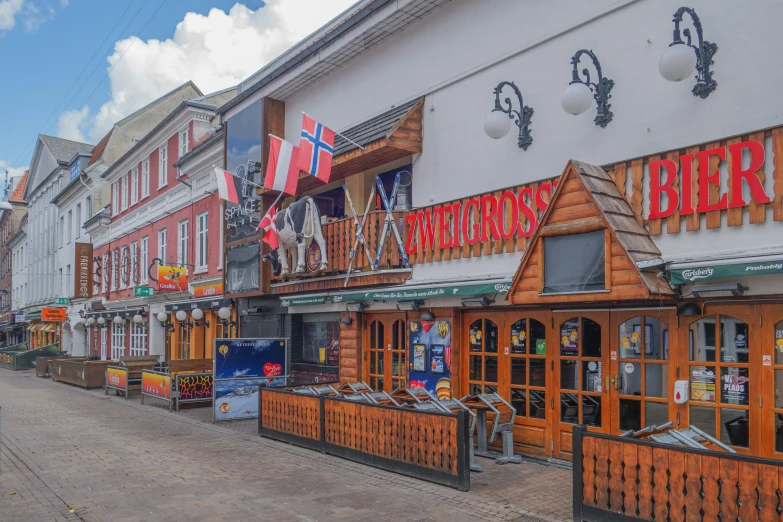 a small town with businesses and shops on a road